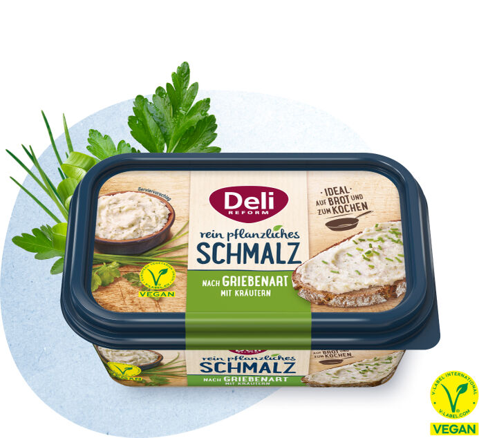 Rechteckige Margarineverpackung der Marke Deli Reform mit Aufschrift 'rein pflanzliches Schmalz nach Griebenart mit Kräutern' und veganem Siegel, umgeben von Petersilienzweigen